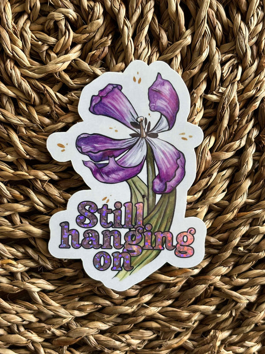 Still Hanging On Sticker - Ellen Wilberg