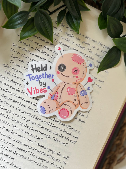 Held together by vibes sticker