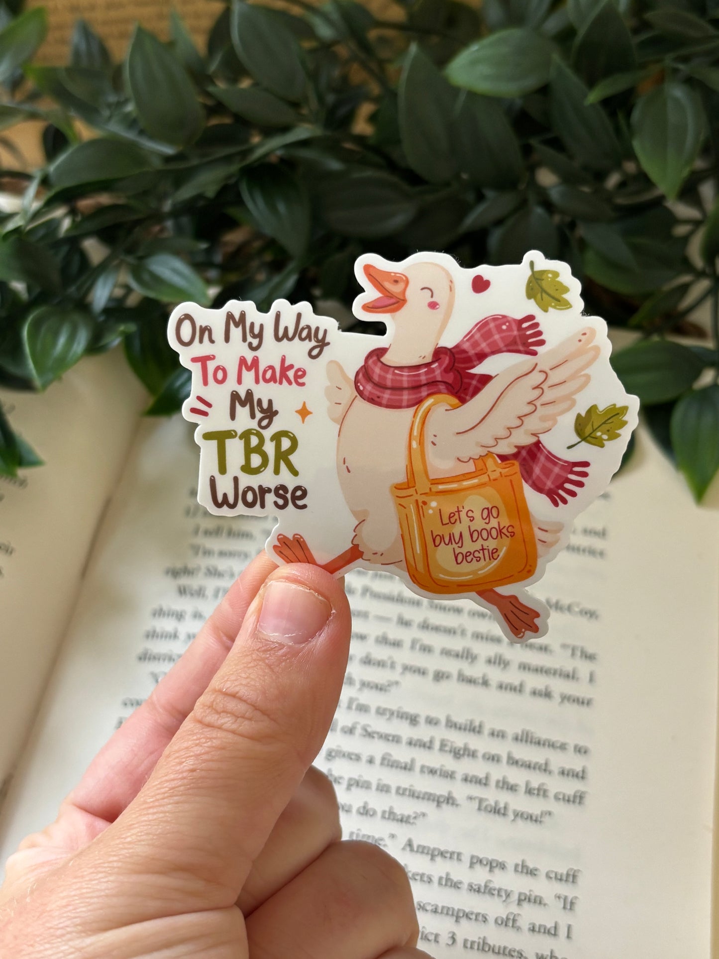 On my way to make my TBR worse Sticker
