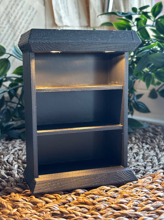 Miniatyr bokhylle med lys