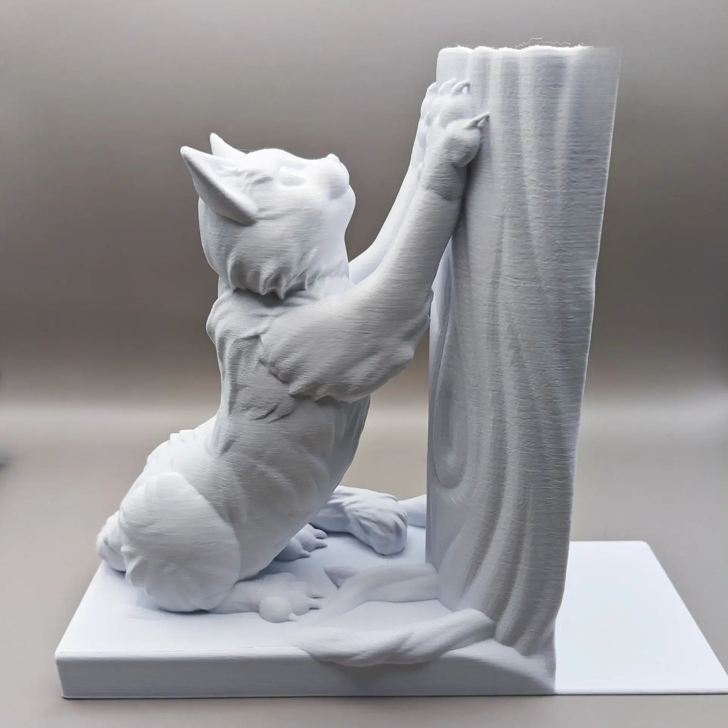 Bokstøtte - Scratching Cat
